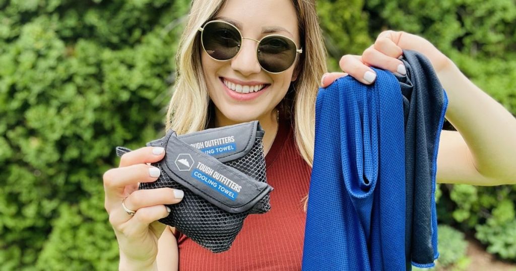 woman holding cooling towels