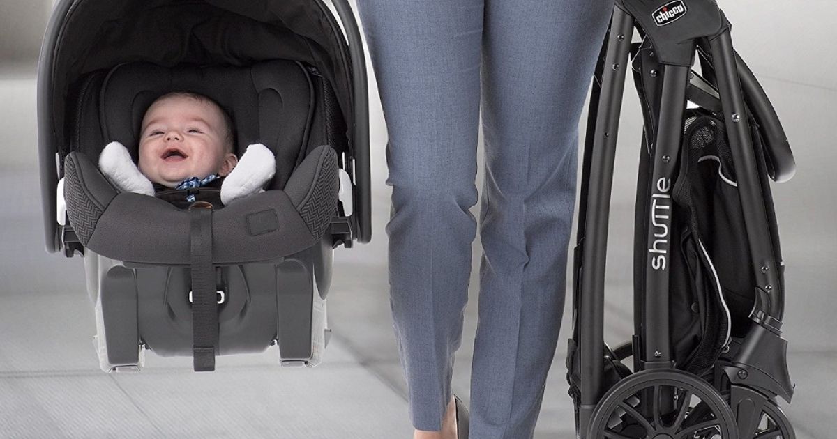 woman walking with folded shuttle stroller