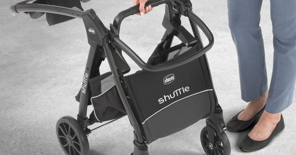 woman folding Chicco shuttle stroller