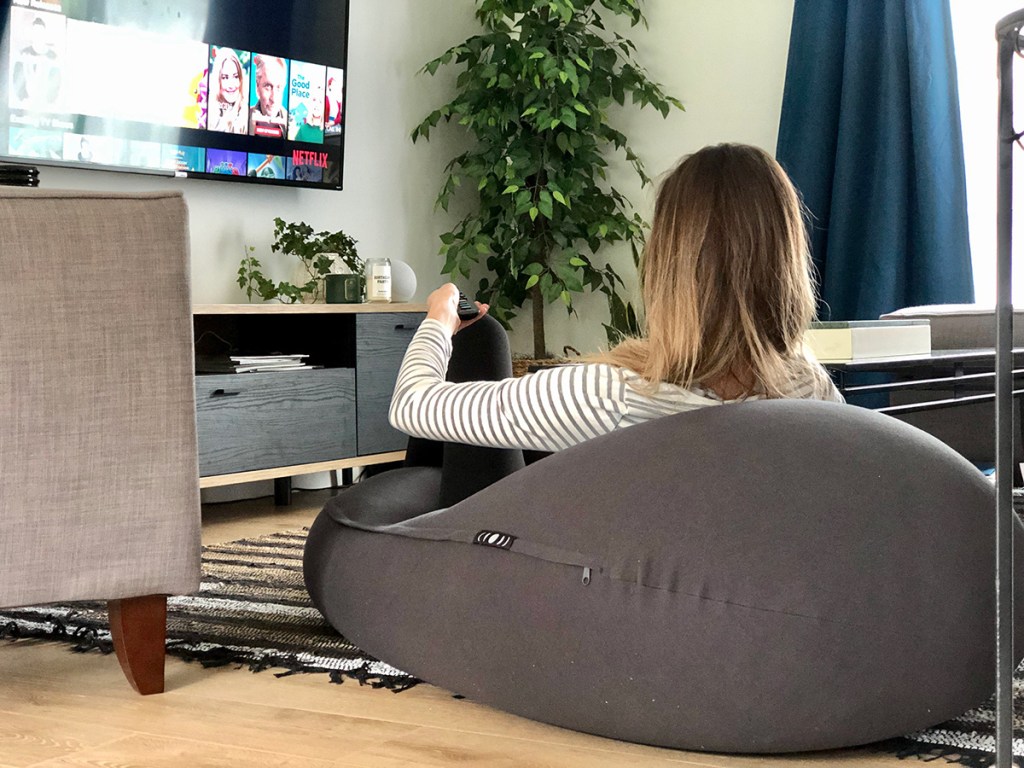 woman sitting on mood pod watching netflix