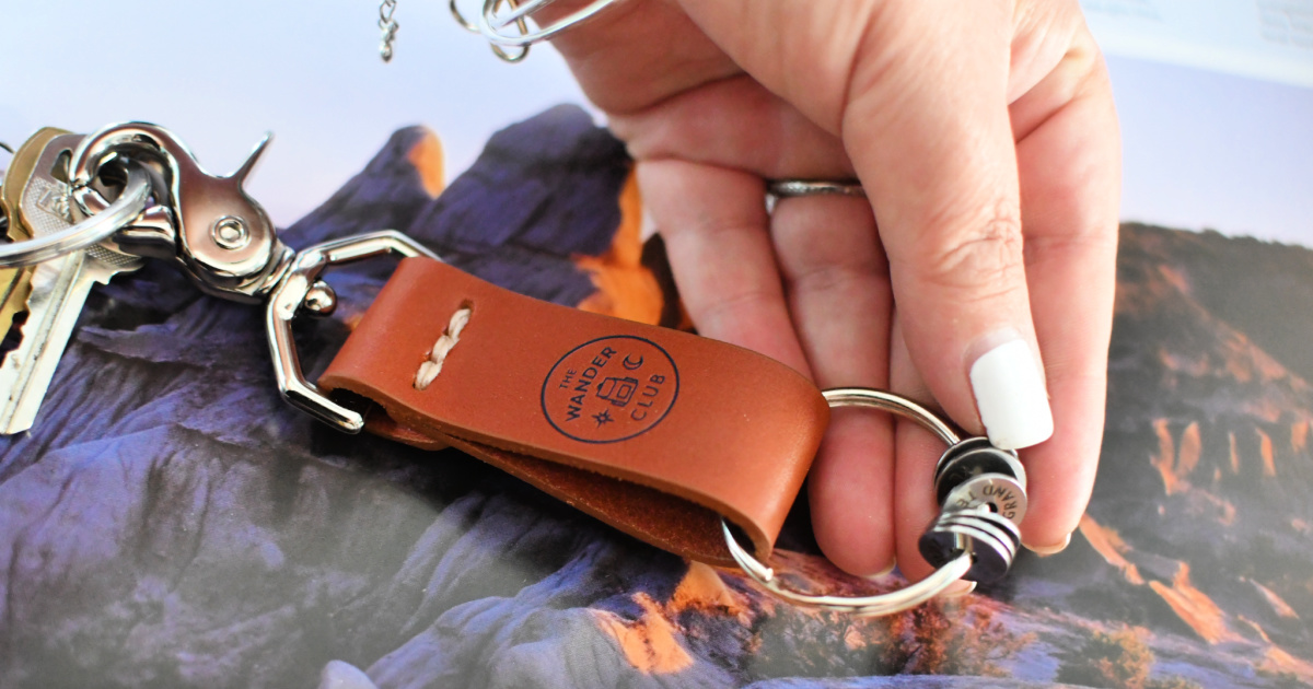 holding a wander club key chain