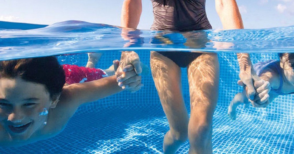 people swimming in pool water