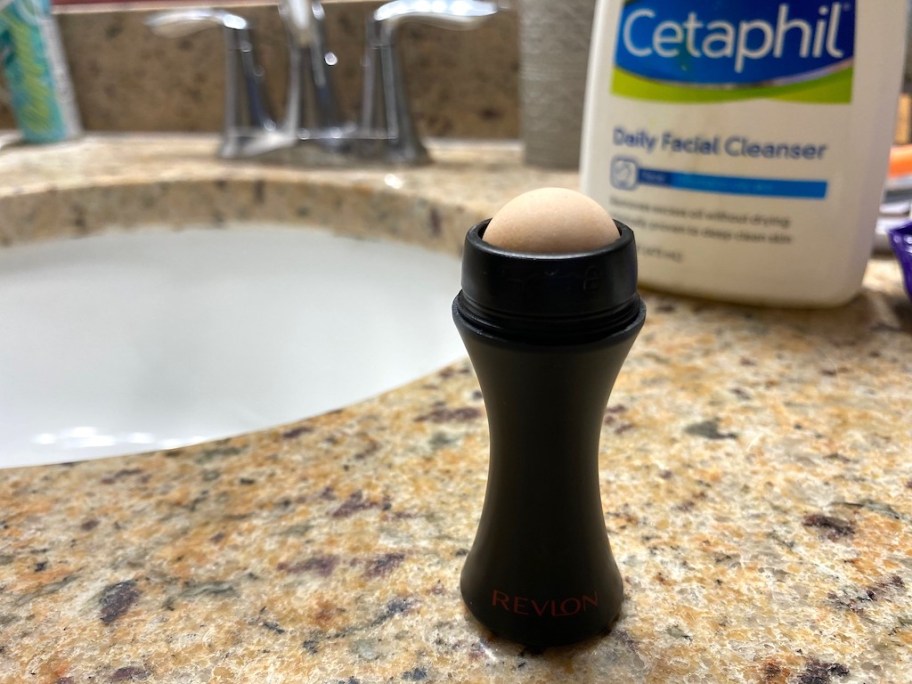 Revlon Oil-Absorbing Roller on bathroom counter