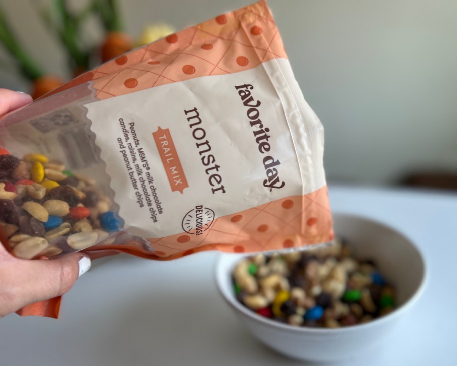 pouring trail mix into bowl