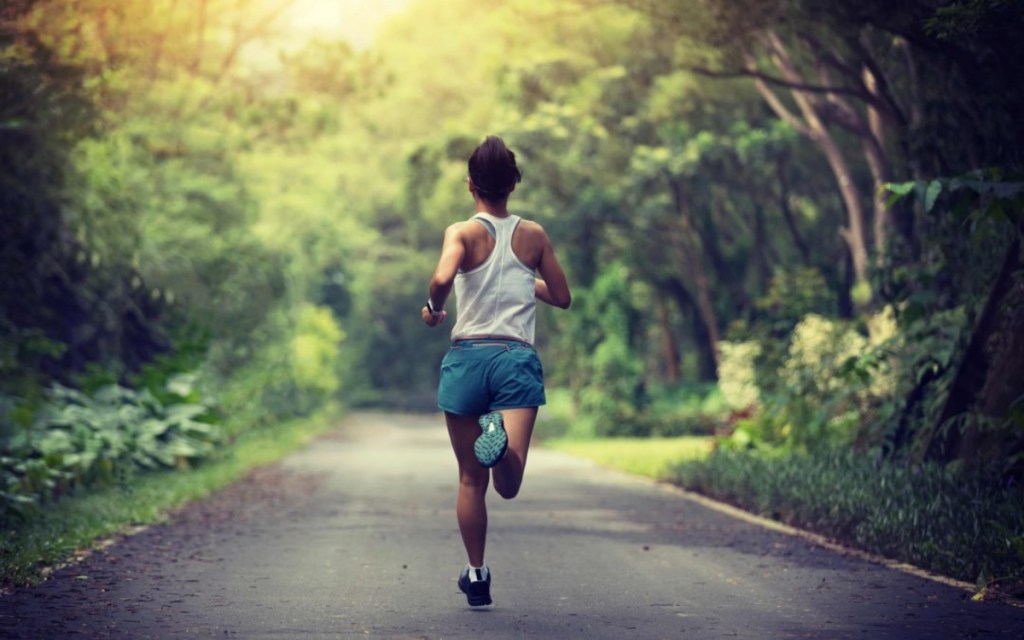 woman running on road