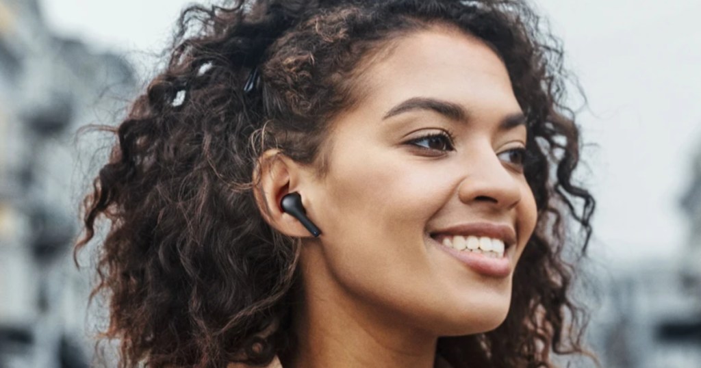 woman wearing aukey earbuds