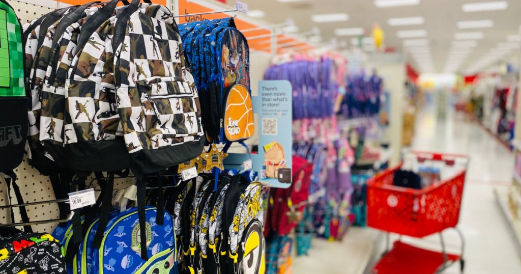 kids' backpacks hanging on shelf 