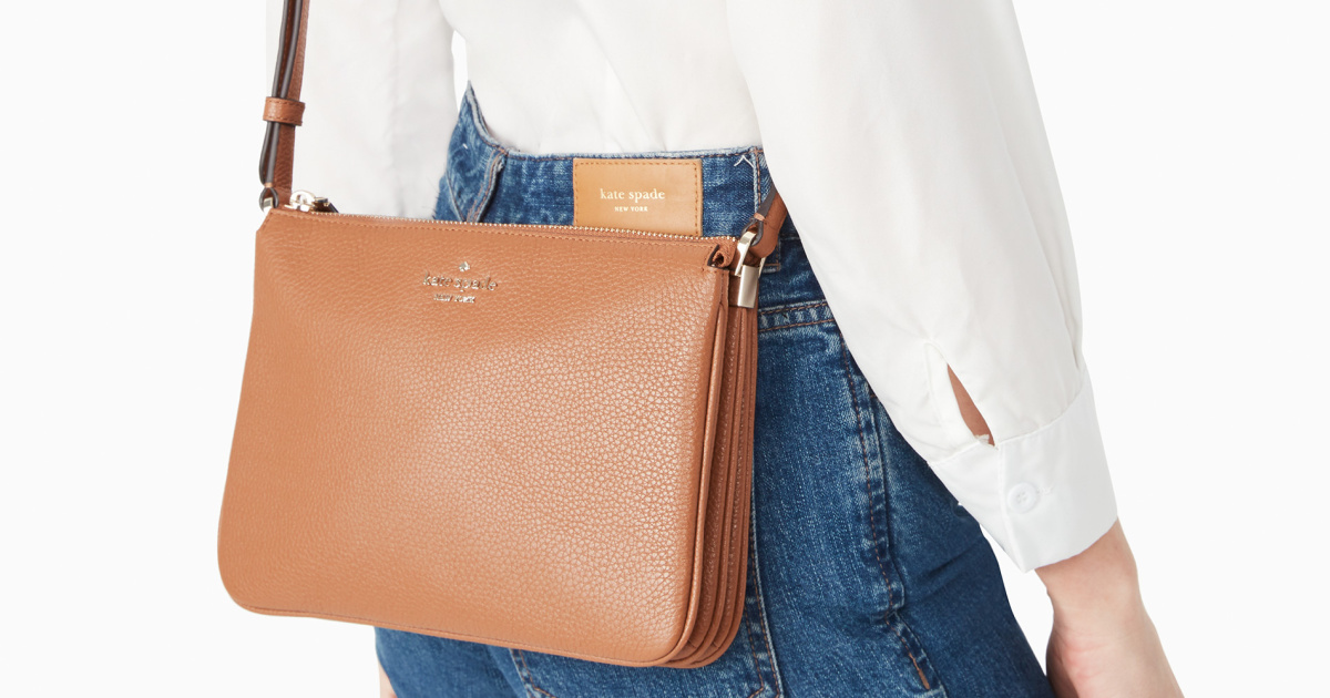 woman wearing brown leather purse