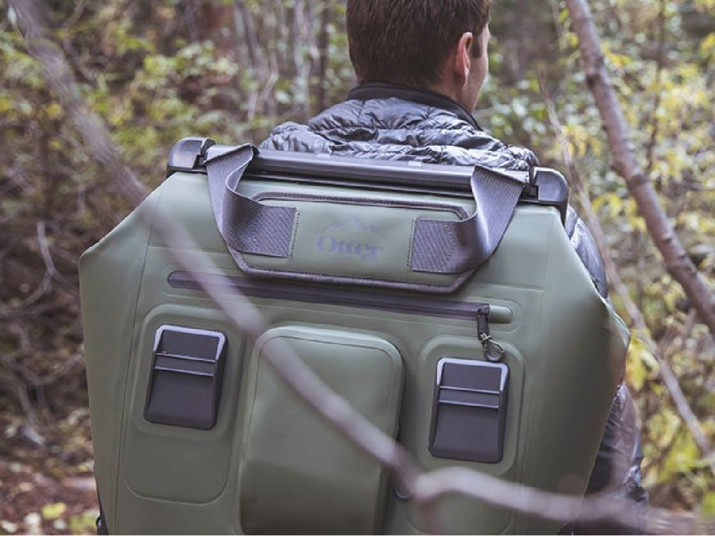 man wearing green otterbox cooler