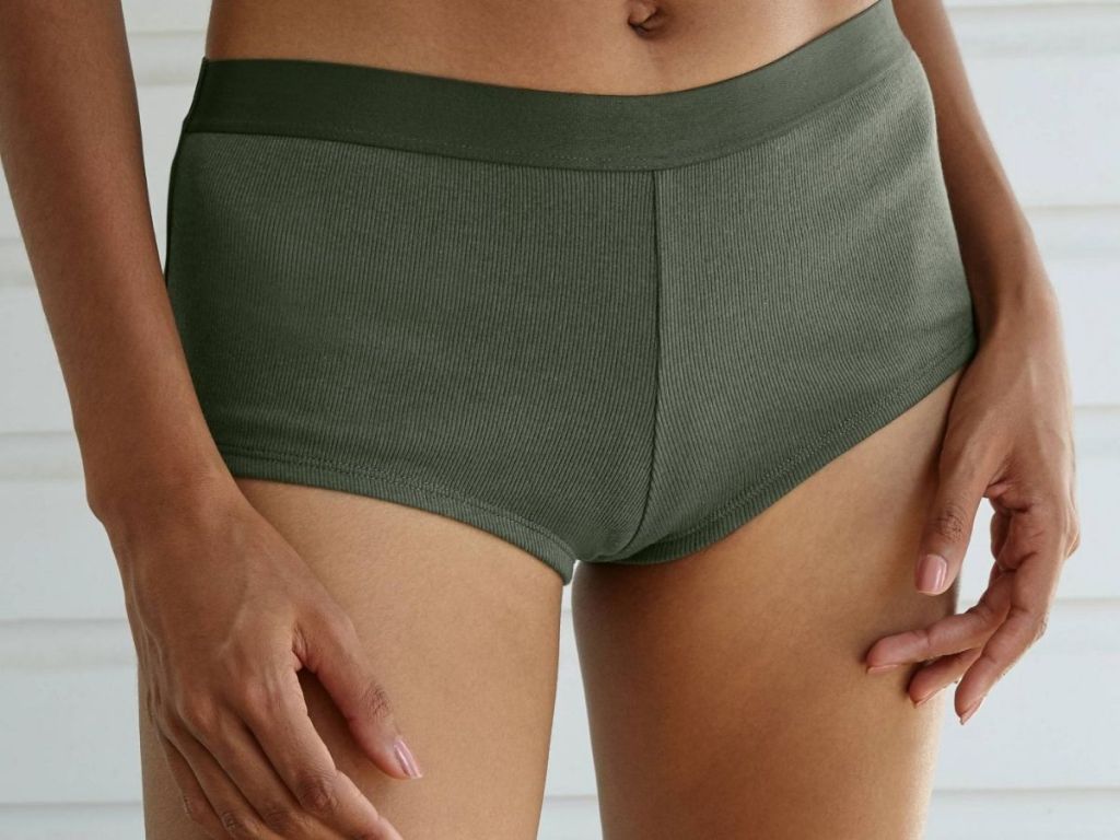 woman wearing green boy shorst