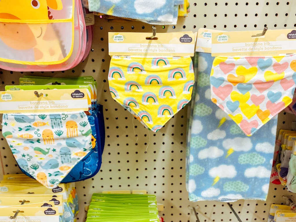 store display with baby bibs hanging on peg boards