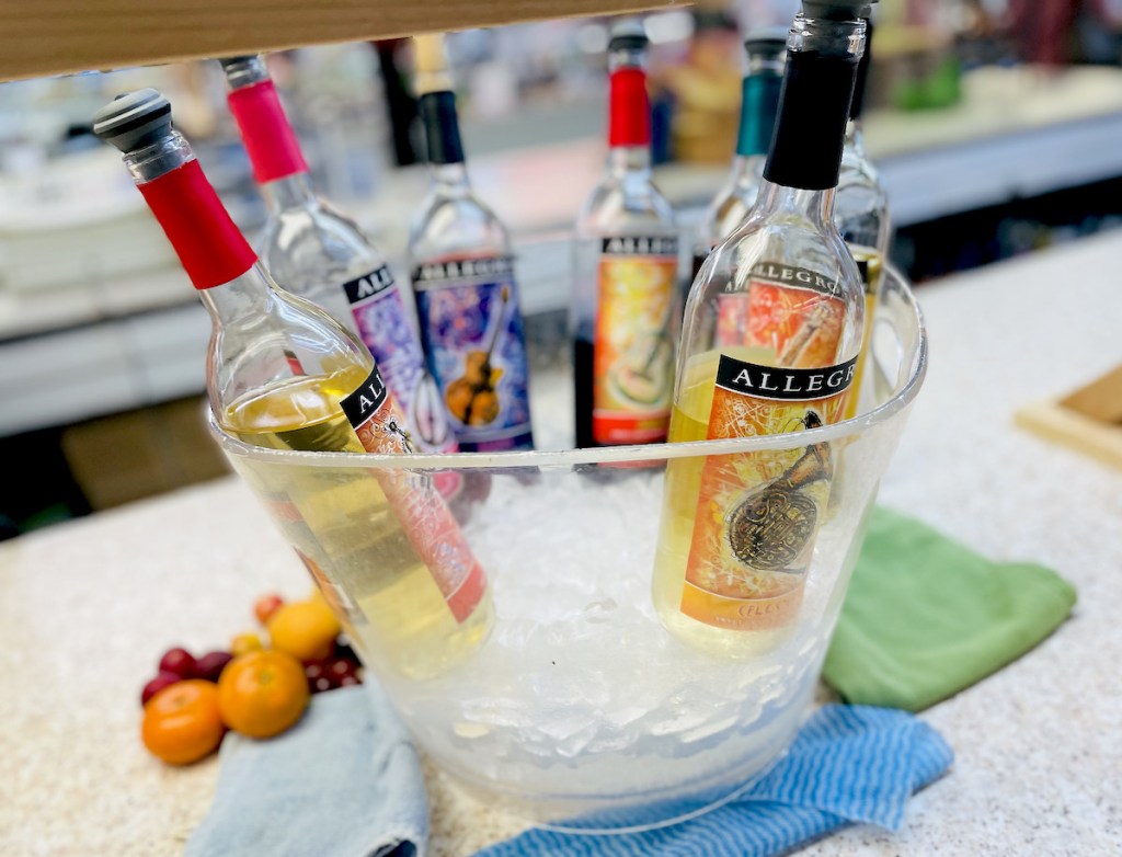 half empty bottles of wine in clear bowl with ice