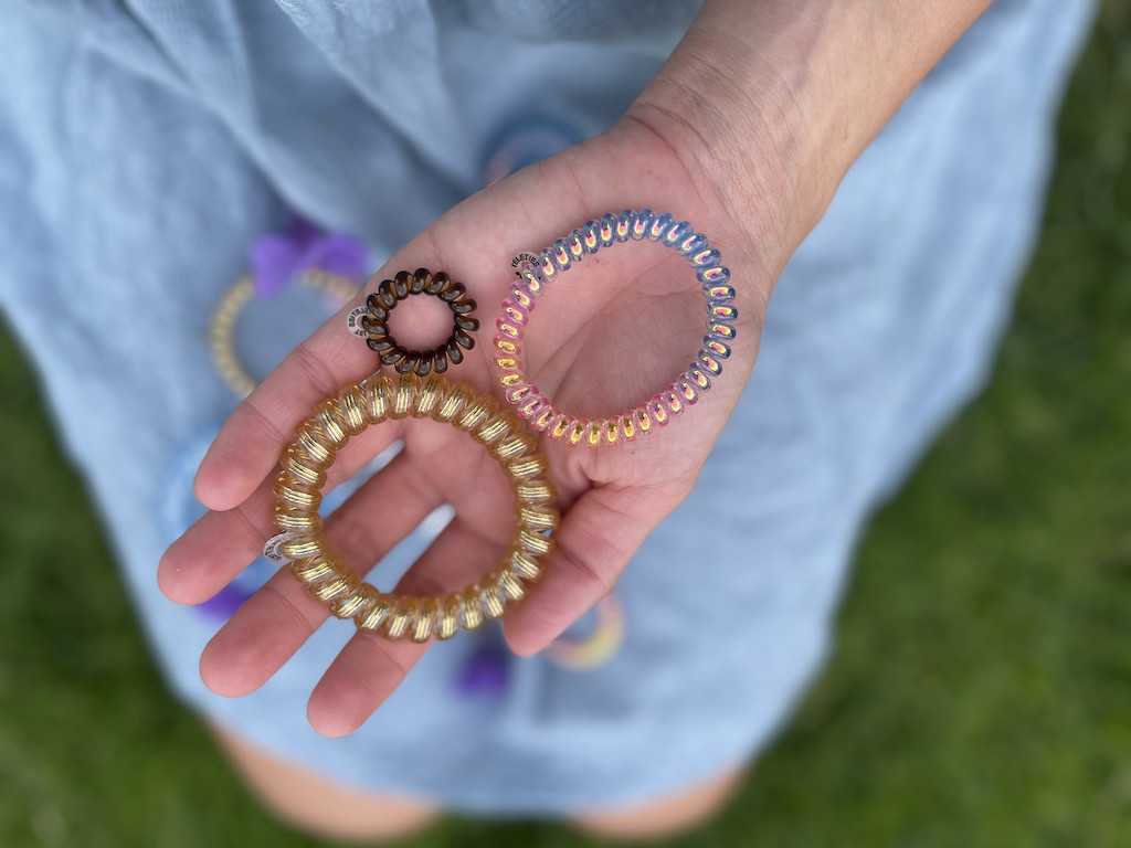 holding teleties hair ties in hand