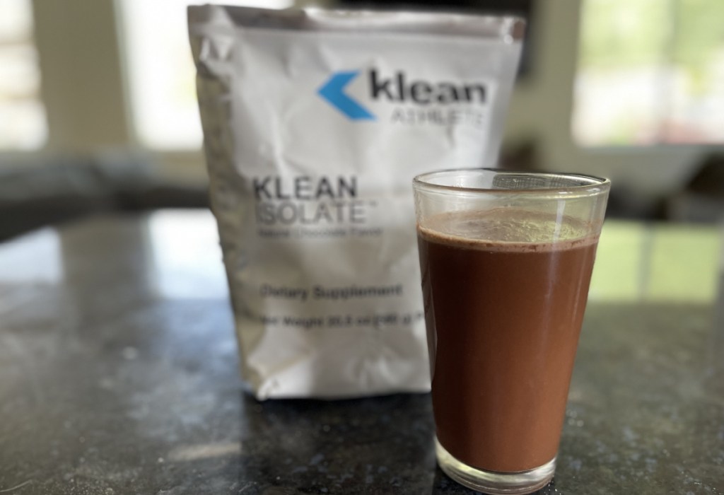 klean athlete protein powder in glass