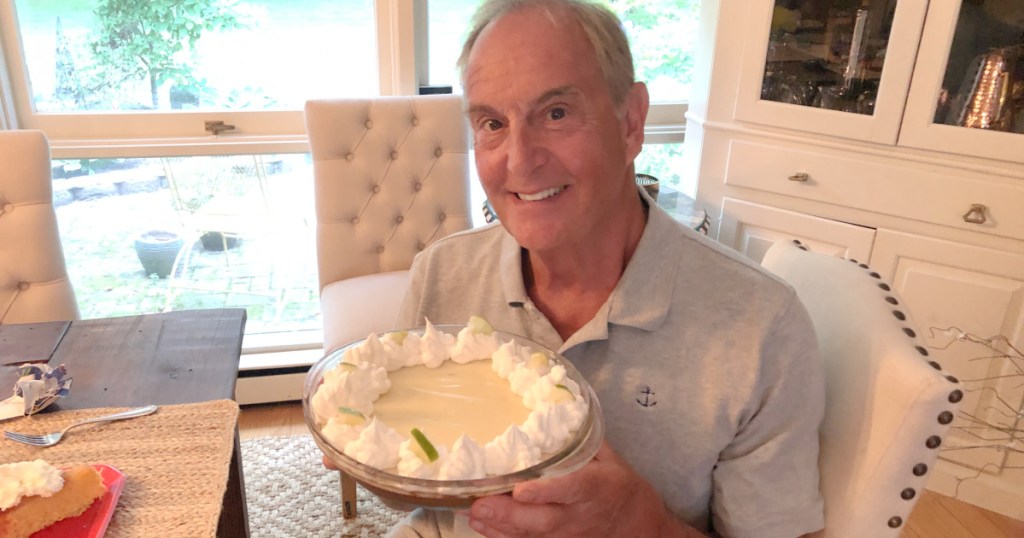 man holding key lime pie