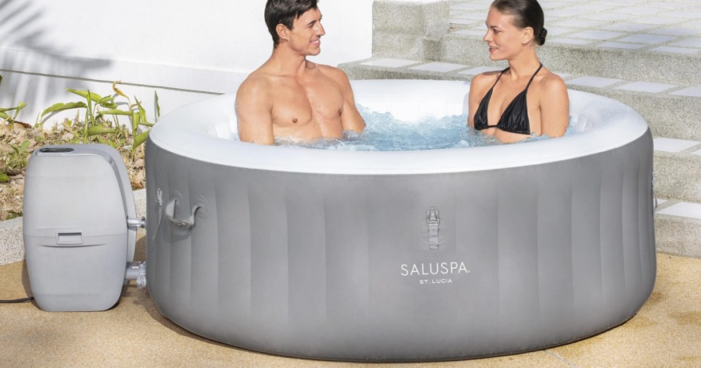 people sitting in saulspa hot tub