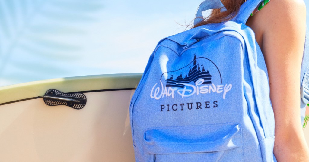 woman wearing walt disney backpack