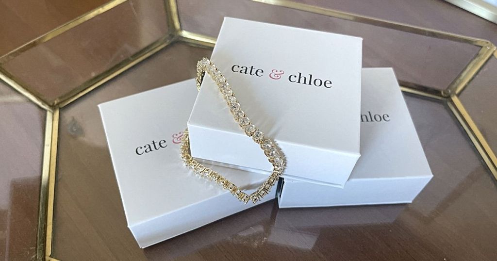 diamond bracelet draped over Cate & Chloe boxes