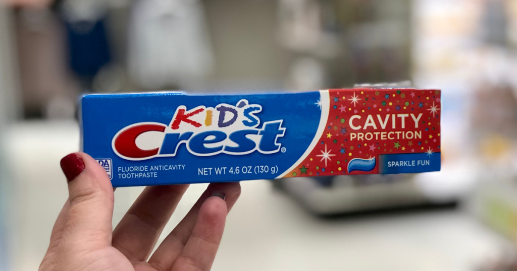 hand holding Crest Kids Cavity Protection Sparkle Fun