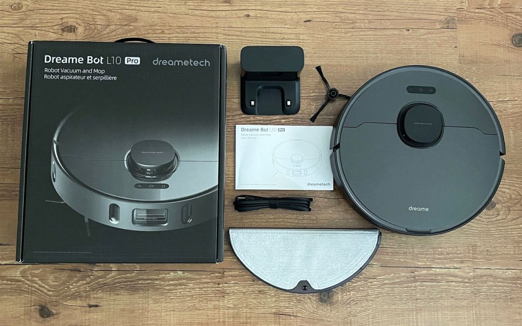 black robotic vacuum with accessories