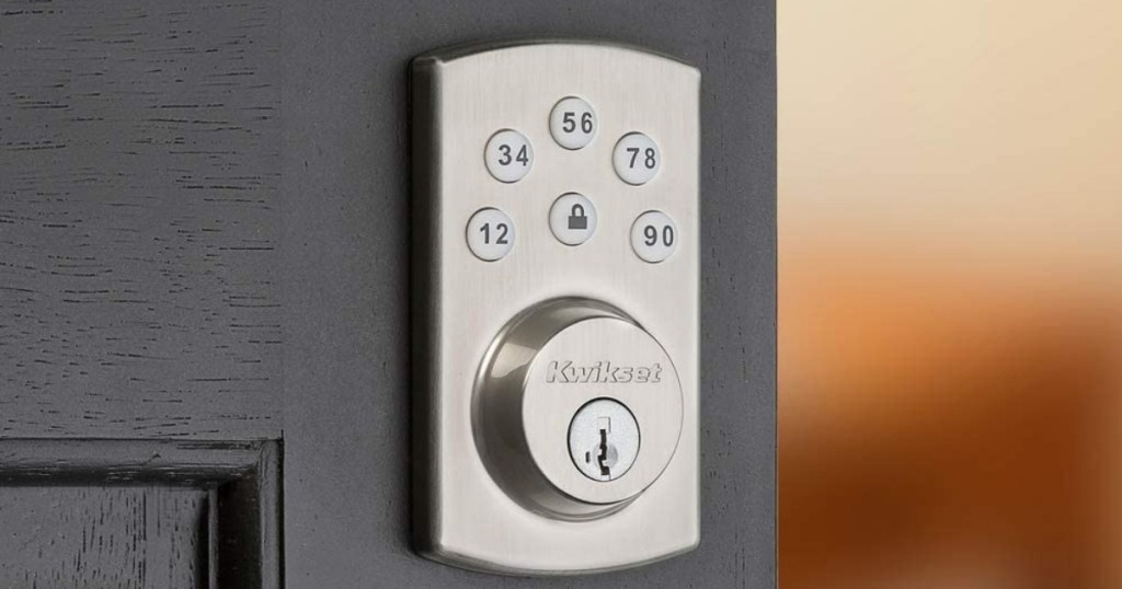 electronic deadbolt in silver on black door