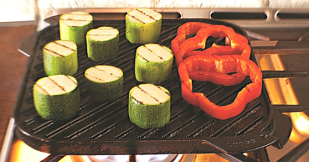 cast iron grill on stove with veggies