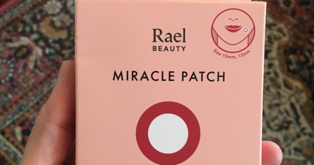 Woman holding a box of Rael Beauty Miracle Patch