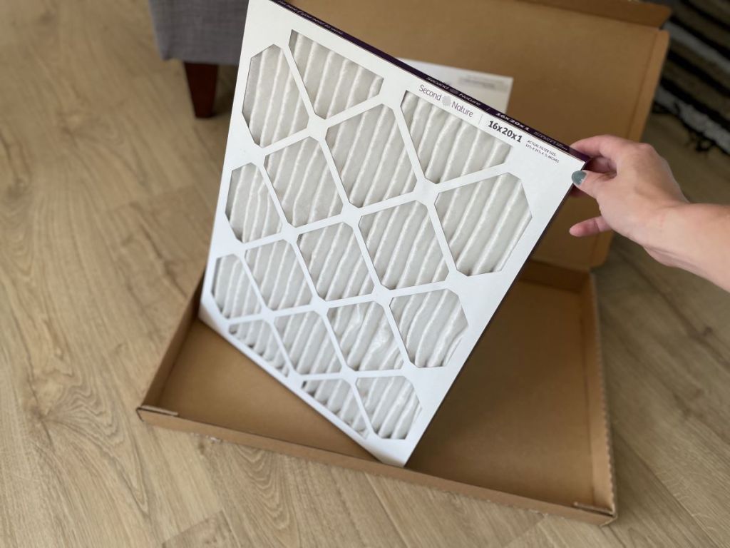 hand holding an air filter