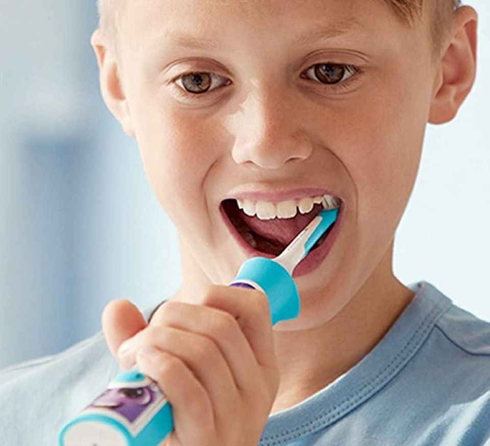 boy brushing his teeth