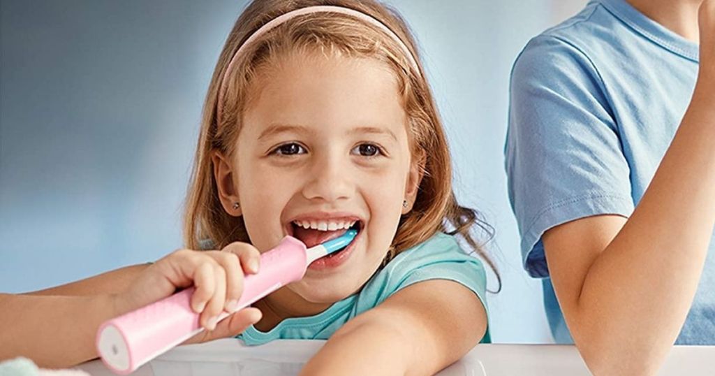 girl brushing her teeth