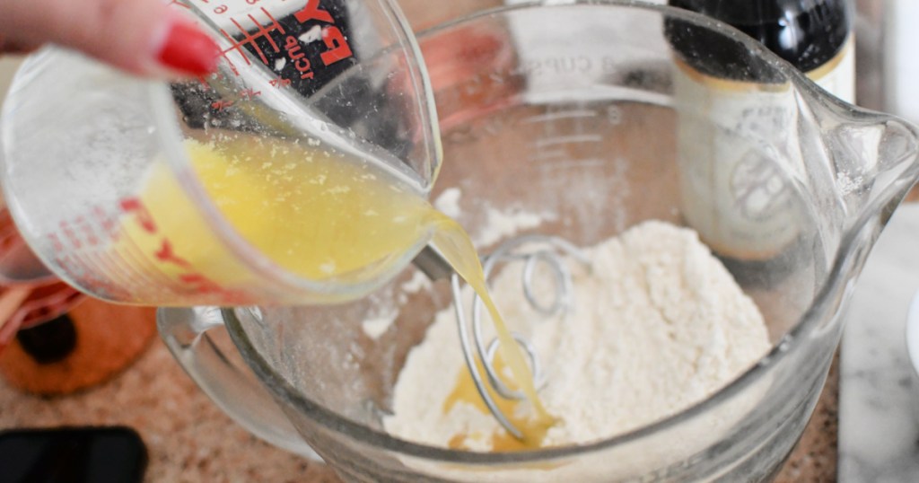 adding butter to pancake batter