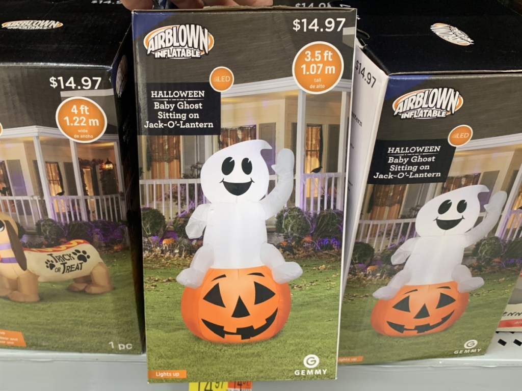 store shelf with box that has Halloween inflatable in it