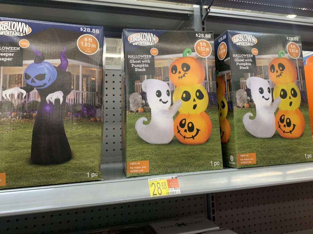 store shelf with boxes of Halloween inflatables