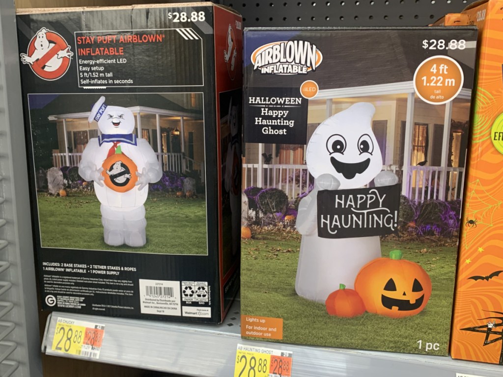 store shelf with boxes of Halloween decor on it