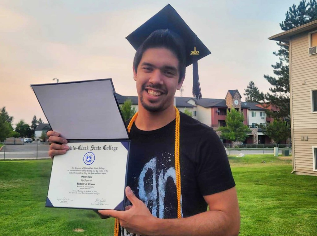 man holding diploma