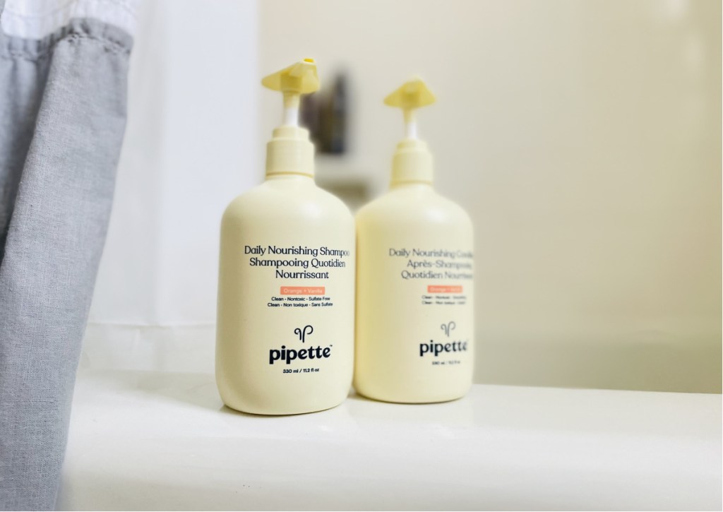 pipette shampoo and conditioner bottles on tub