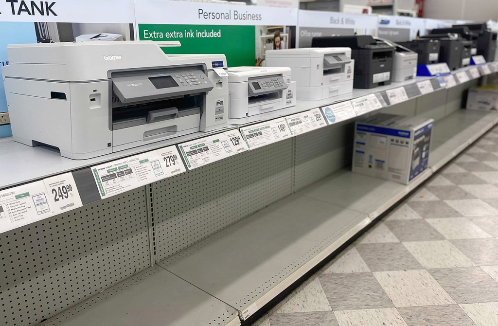 printers on shelf at office store during chip shortage