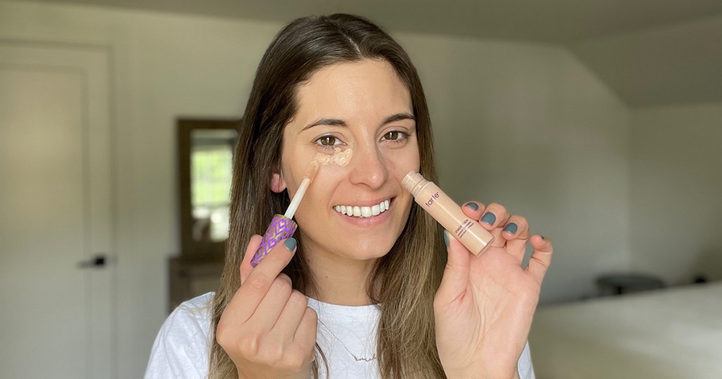 woman using tarte shape tape concealer