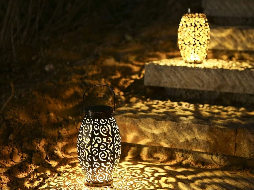 patterned lantern on steps at night