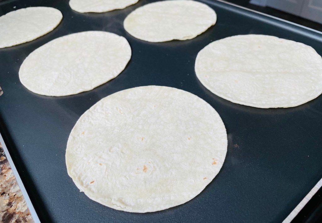 tortillas on griddle