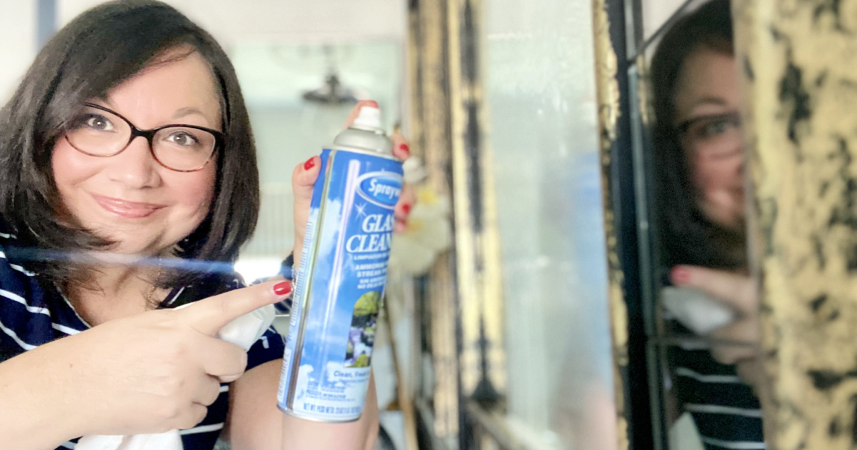 woman pointing to sprayway glass cleaner