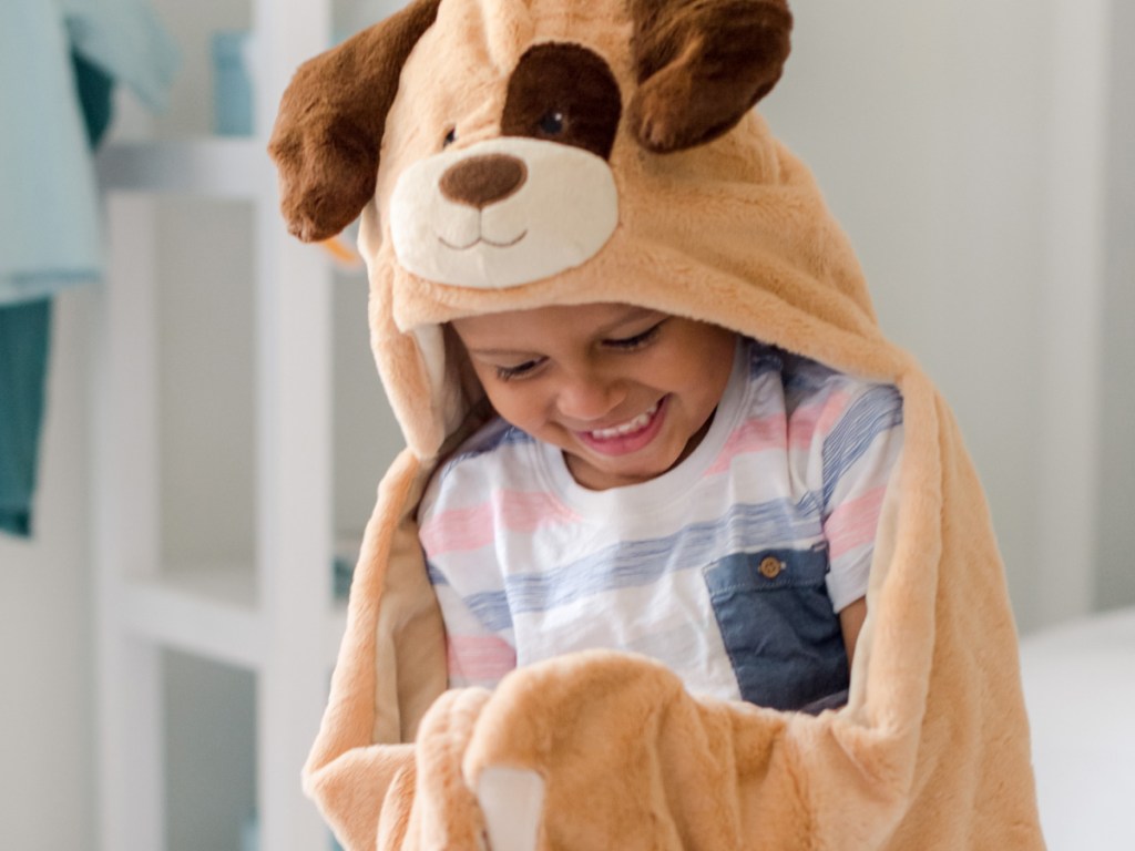 boy wearing a hooded dog cape