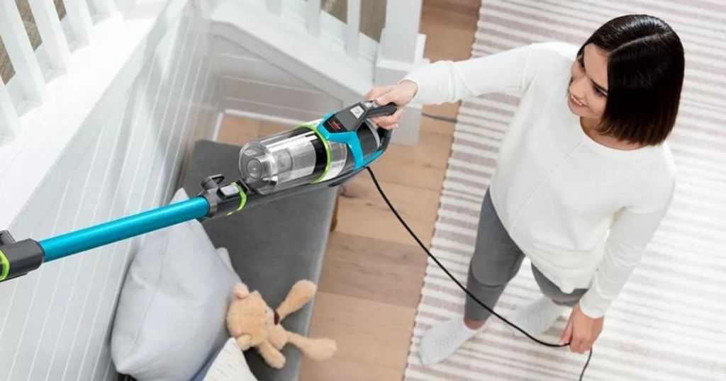 woman holding a vacuum