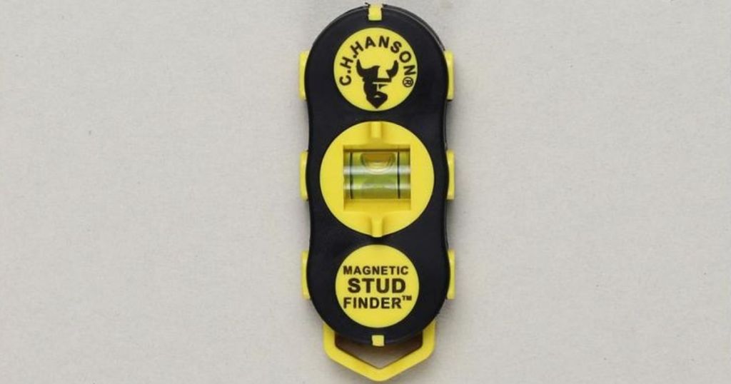 magnetic stud finder stuck to wall