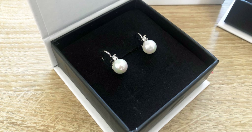 pair of pearl earrings in a box