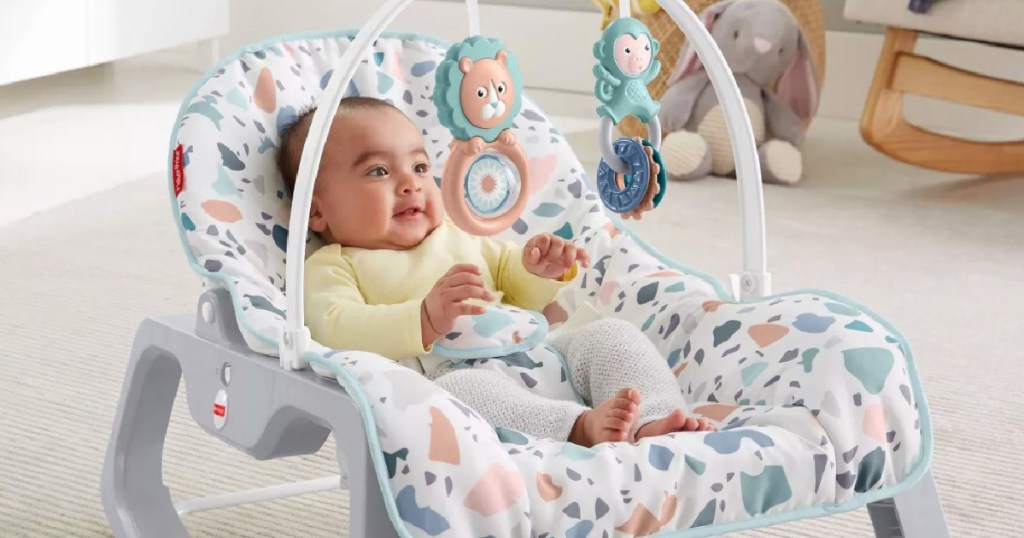 baby in rocker chair on floor