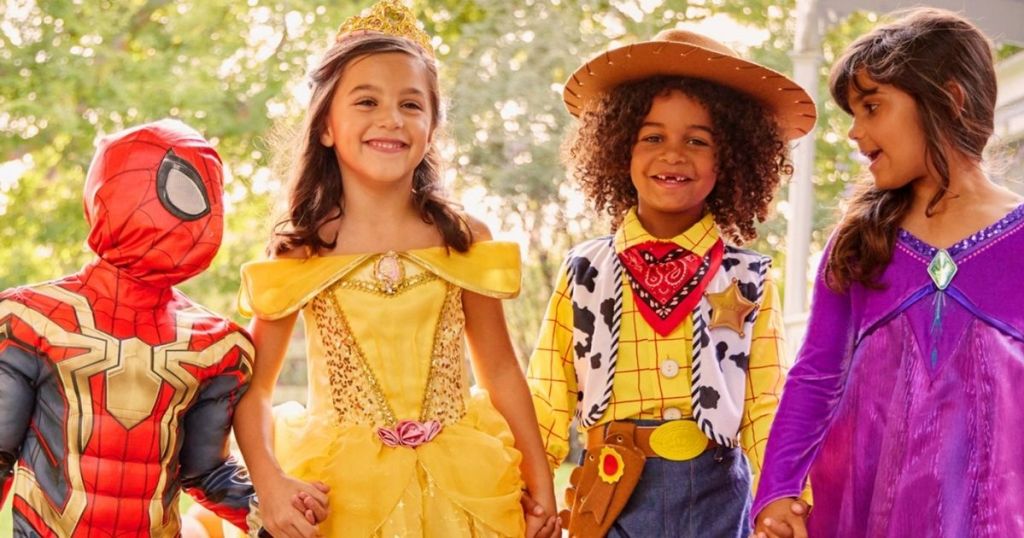 four kids in Disney costumes