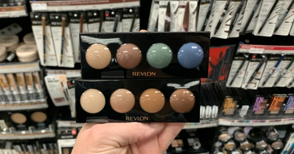 hand holding two Revlon Creme Eyeshadows