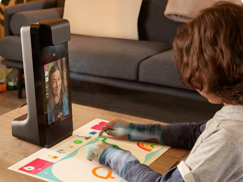 chid using projector to talk with family