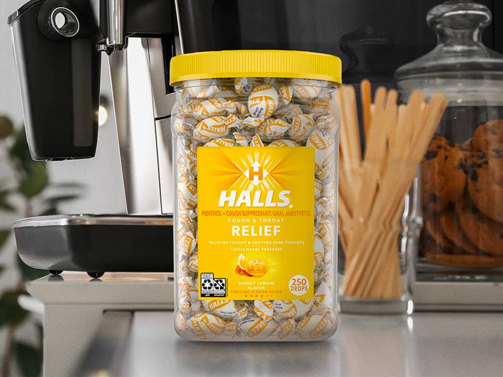 jar of honey lemon cough drops next to coffee machine